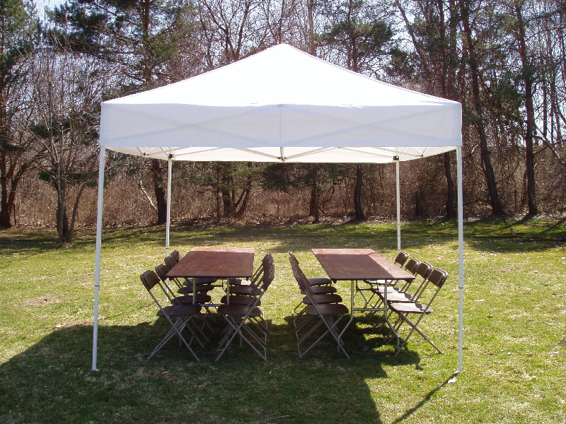 tent with tables and chairs